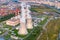 City thermal power station close to massive residential areas in the evening before sunset, aerial view