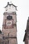 City tower with sundial and steeple in old town. Medieval architecture. Memmingen landmark. Historical city tour.