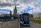 A city tram rides through the streets of the city. The tram goes through the city of Moscow