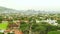 City, trees and office buildings with drone, infrastructure with rooftop and skyline in cbd. Urban landscape