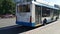 City trolley departs from the stop and behind him in the frame there is a young man who was late for transport