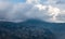 City urbanization view from hilltop with huge construction and dramatic sky