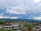 City urbanization view with mountain range at background at morning from flat angle