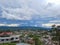 City urbanization view with mountain range at background at morning from flat angle