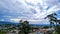 City urbanization view with mountain range at background at morning from flat angle