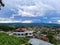 City urbanization view with mountain range at background at morning from flat angle