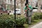 A city utility worker dripping lawn on the street