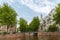 City view of Amsterdam canal, church and typical houses, Holland