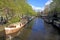 city view with canal, houseboats and traditional houses, Amsterdam