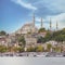 City view from Karakoy overlooking Golden Horn with docked ferry boats, and Suleymaniye Mosque, Istanbul, Turkey