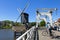 City view Leiden with drawbridge, windmill, cyclist