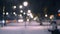 City view lights, falling snow, night street, bokeh spots of headlights of cars