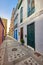 City view of residential houses or buildings in quiet alleyway street in Santa Cruz, La Palma, Spain. Historical spanish