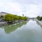 City view with river and trees on riverside