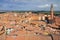 City view of Siena, Tuscany, Italy, with bell tower and square: Torre del Mangia and Piazza del Campo