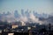 city, with view of smoggy skyline and billowing smoke stacks