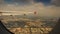 City view under airliner wing out of window