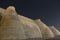 City walls of the ancient city of Bukhara in Uzbekistan, at the starry night. Wall of the massive Ark fortress