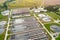 City water purification. Wastewater flows through large circular tanks with power-driven scrapers. View from above