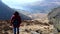 City woman walking hill path above Dovestone handheld camera