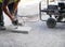 City workers - disc grinder and paving slab
