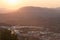 Cityscape of Alcoy with its mountains in the background during the summer solstice sunrise