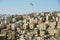 Cityscape of Amman downtown with residential buildings and waving National flag in Amman, Jordan.