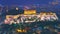 Cityscape of Athens with illuminated Acropolis hill, Pathenon and Herodium construction and sea at night. Athens skyline at night