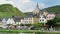 Cityscape of Beilstein at Moselle River. Birch tree in front