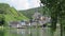 Cityscape of Beilstein at Moselle River. Birch tree in front