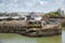 Cityscape of Biarritz, France: Small white lighthouse in the old harbor