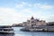 Cityscape of Budapest with bright parliament and Danube river with bridge.