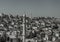 The cityscape, buildings, roofs, and mosque minarets, at Ramallah.