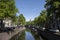 Cityscape of a canal with monumental buildings. Gouda, the Netherlands