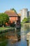 Cityscape of Canterbury, Kent UK with the West Gate tower and canal of river Stour.