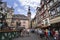 Cityscape of Cochem with its typical half-timbered houses and restaurants. Market square with town hall in background, people cele