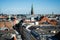 cityscape of Copenhagen with spire of City Hall, Denmark