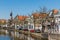 Cityscape of Delft with canal and historic houses,