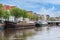 Cityscape Dutch city Zwolle with canal and old cargo ships