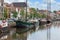 Cityscape Dutch city Zwolle with canal and old sailing ships