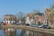 Cityscape Dutch village Makkum with historic houses along a canal