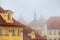 Cityscape on a foggy morning - view of Mala Strana historical neighbourhood of Prague