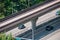 Cityscape. Fragment of four lane road with skytrain path over