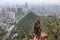 Cityscape of Guiyang at noon, Guizhou Province, China with monkey on foreground.