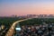 Cityscape of Hanoi skyline at Vinh Tuy bridge over Red river during sunset time