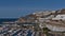 Cityscape of holiday resort Puerto Rico in the south of Gran Canaria island, Spain with large hotel complexes.