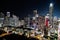 Cityscape of illuminated streets and buildings of Austin at night in Texas