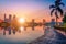 Cityscape image of Benchakitti Park at sunset in Bangkok