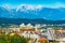 Cityscape of Ljubljana with modern architecture and picturesque snowy Alps in the background, Slovenia