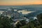 Cityscape Malaga with harbor by sunset and hills in background